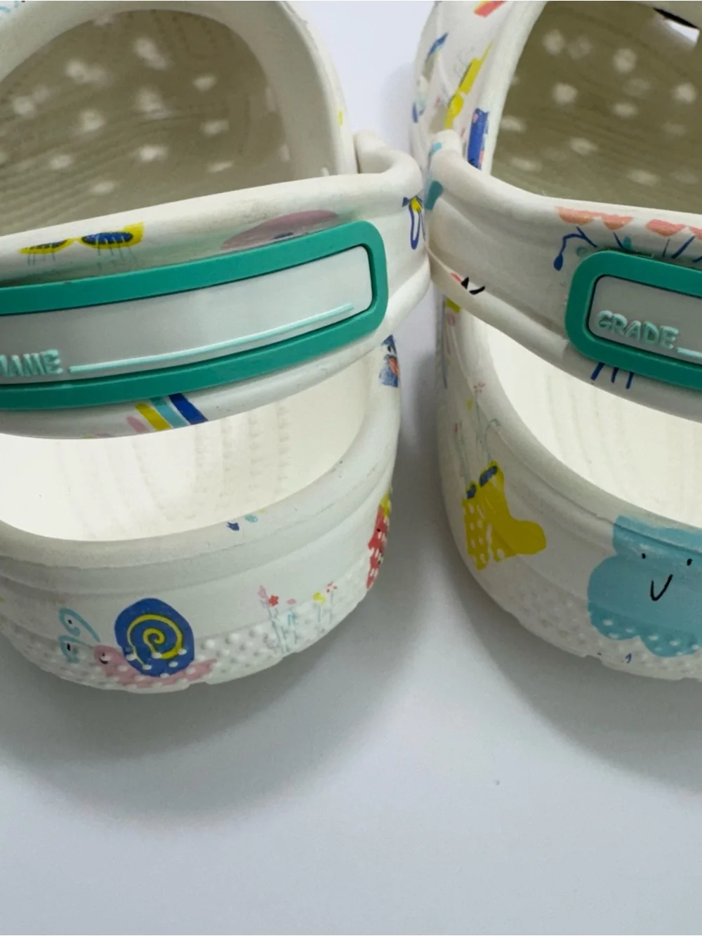 Crocs Kids' Classic Doodle Print Clogs, White & Multicolor Whimsical Pattern J1